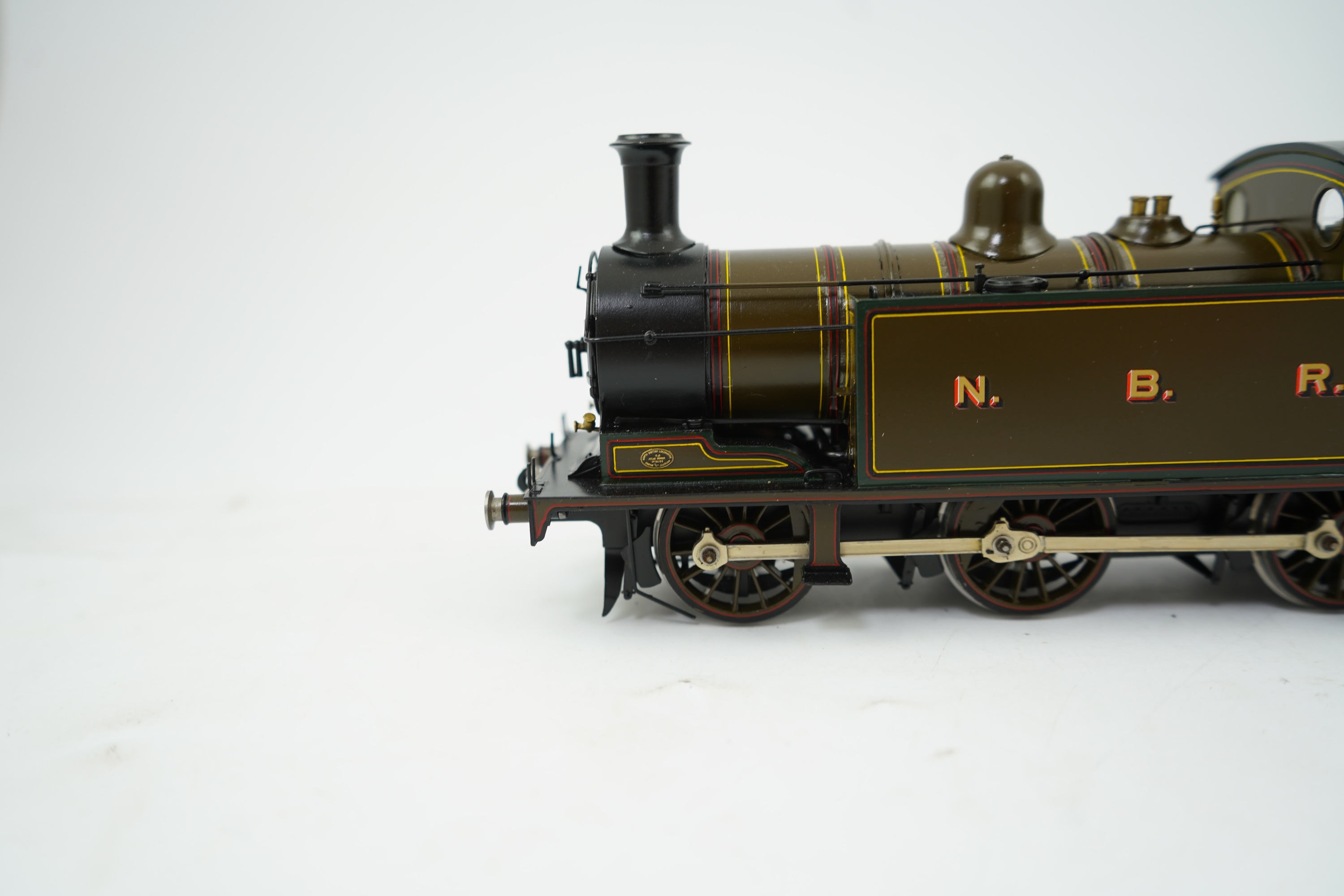 An 0 Gauge brass model of North British Railway William Reid Class A, 386, 0-6-2T locomotive, powered for two rail operation.